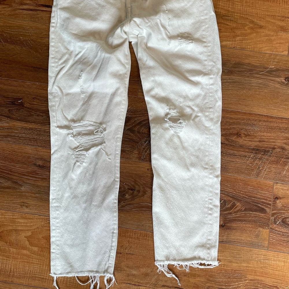 Distressed white Levi’s Wedgies